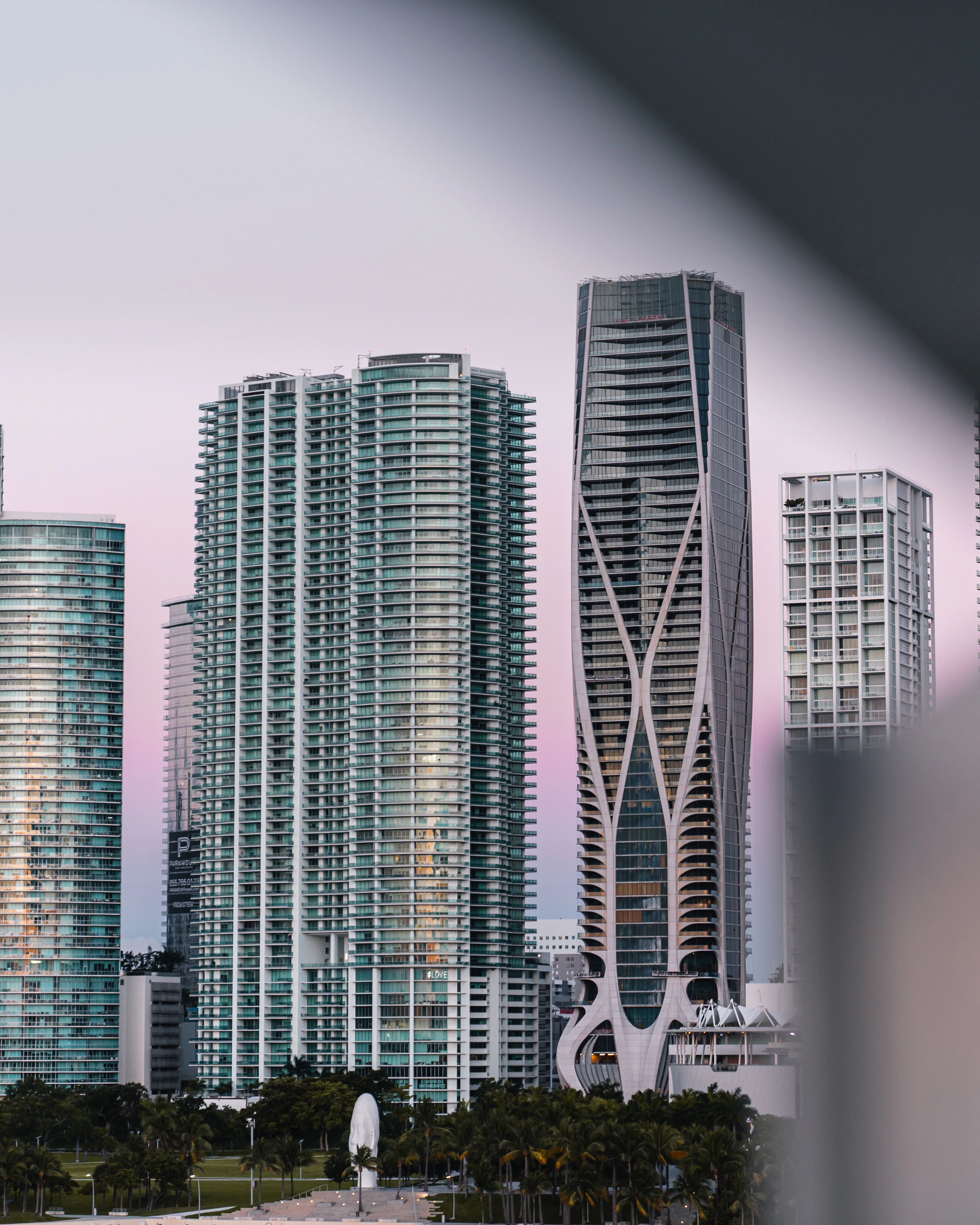 Brickell's glass towers rising against a pink Miami sky