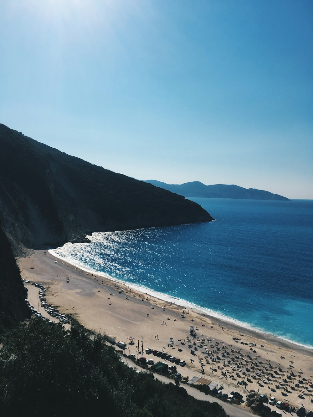 ocean, shore, and mountains