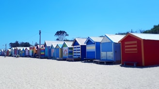 multicolored wooden houses near beach