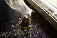 Incense cones burning quietly beside a serene window with morning light streaming in.