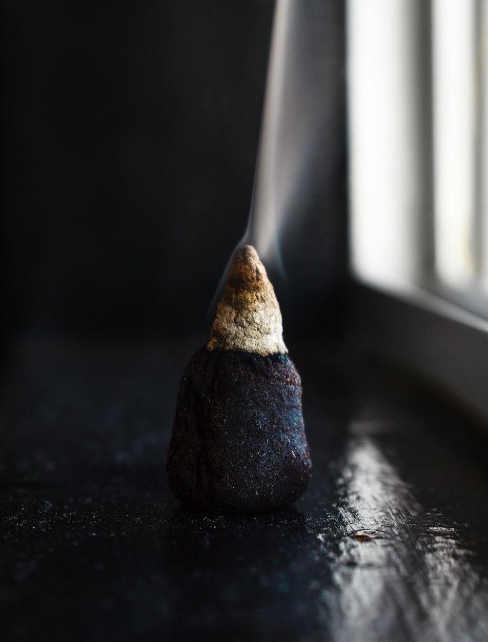 black incense burning in room