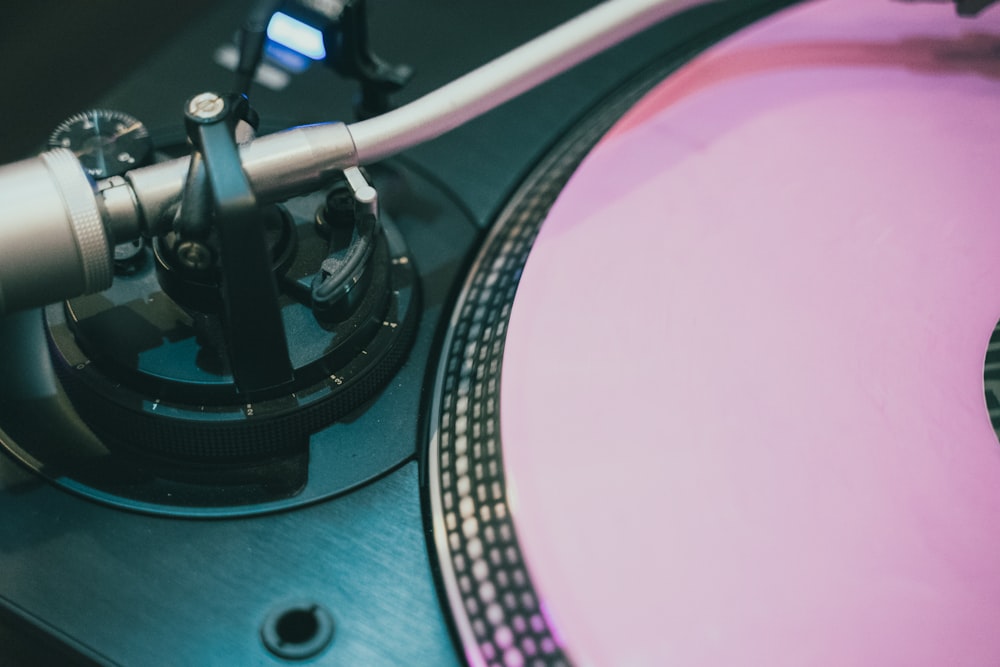 grey and pink vinyl turntable