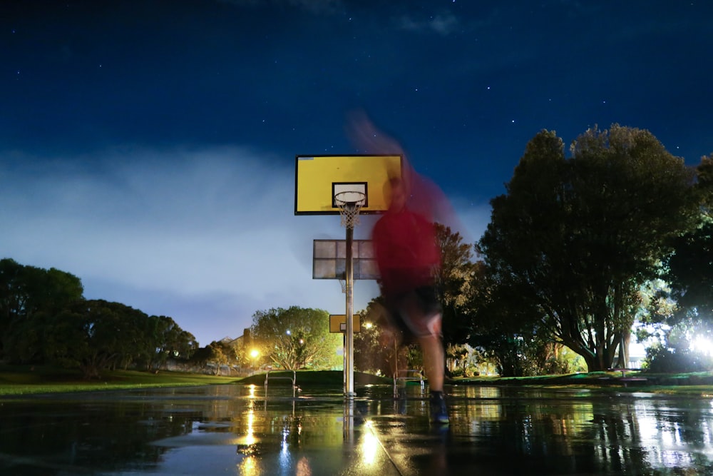 person playing basketball in basketball court