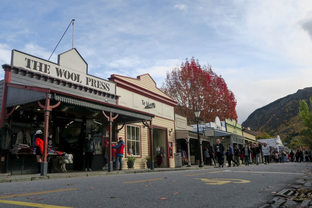 people standing near The Wool Press building