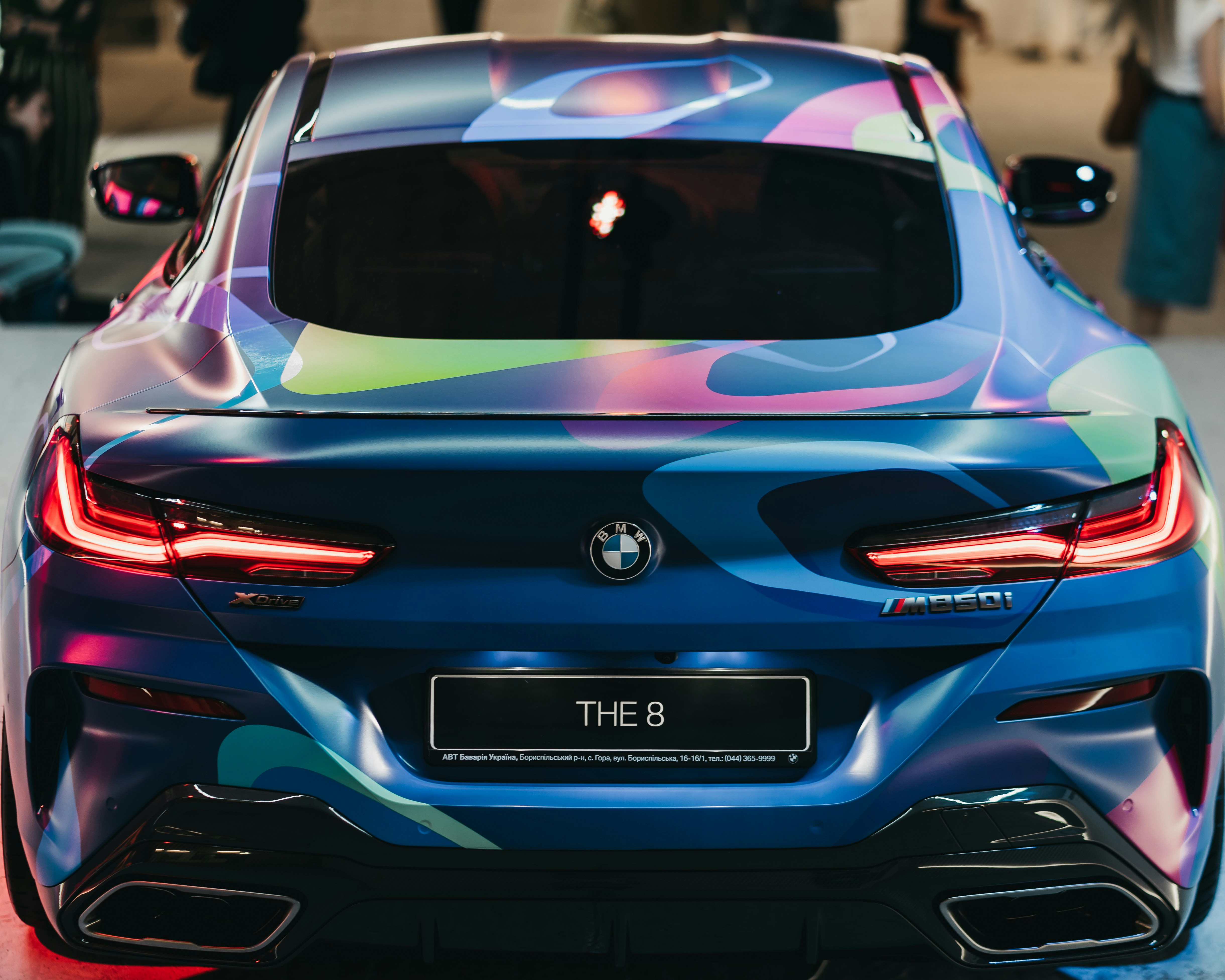 blue BMW car with The 8 license plate
