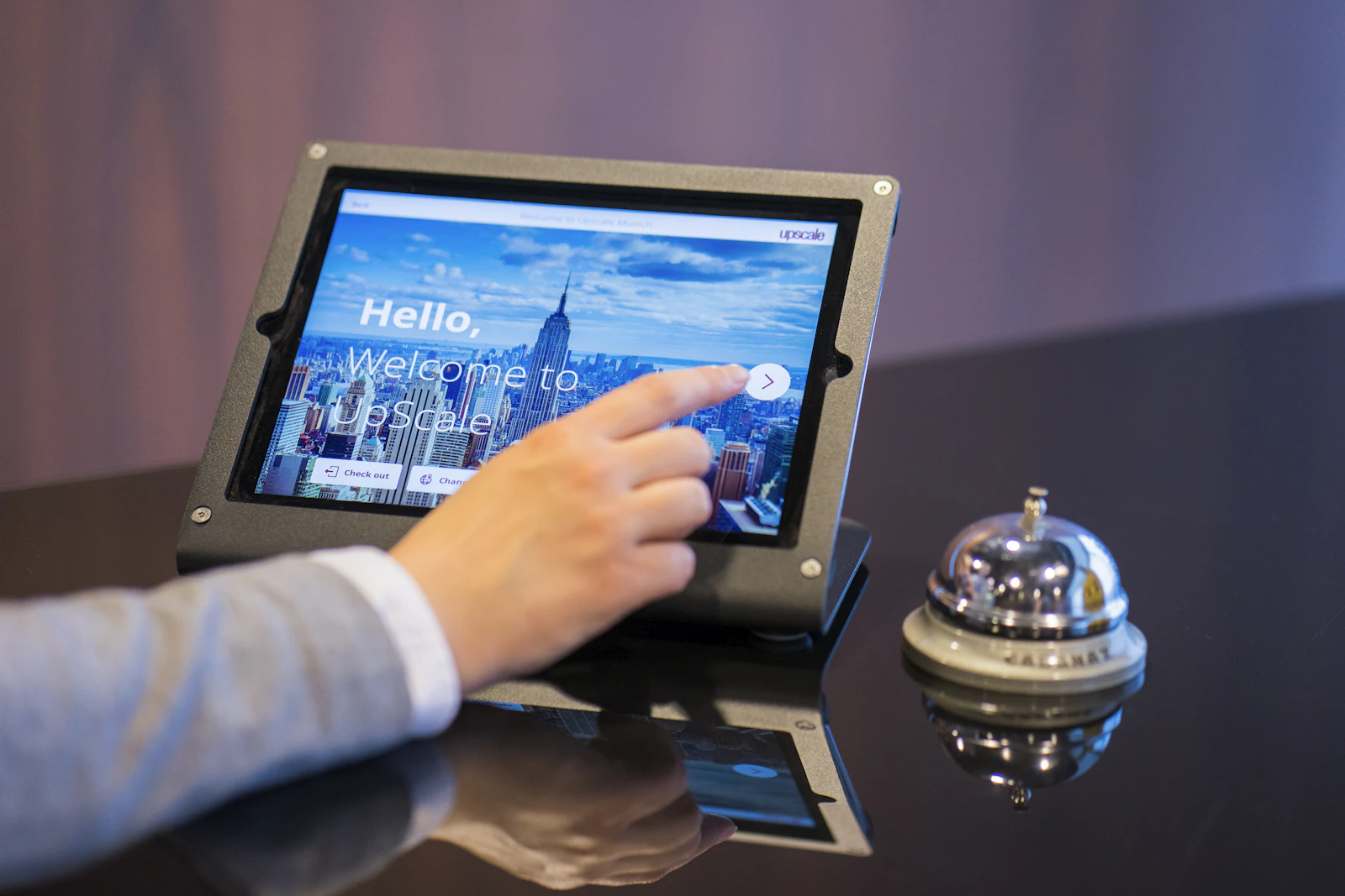 Guest checking in on a hotel lobby tablet