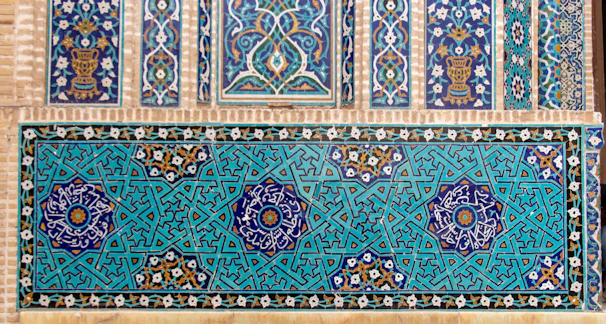 Intricate Moroccan tile patterns alongside British flag motifs in an art display.
