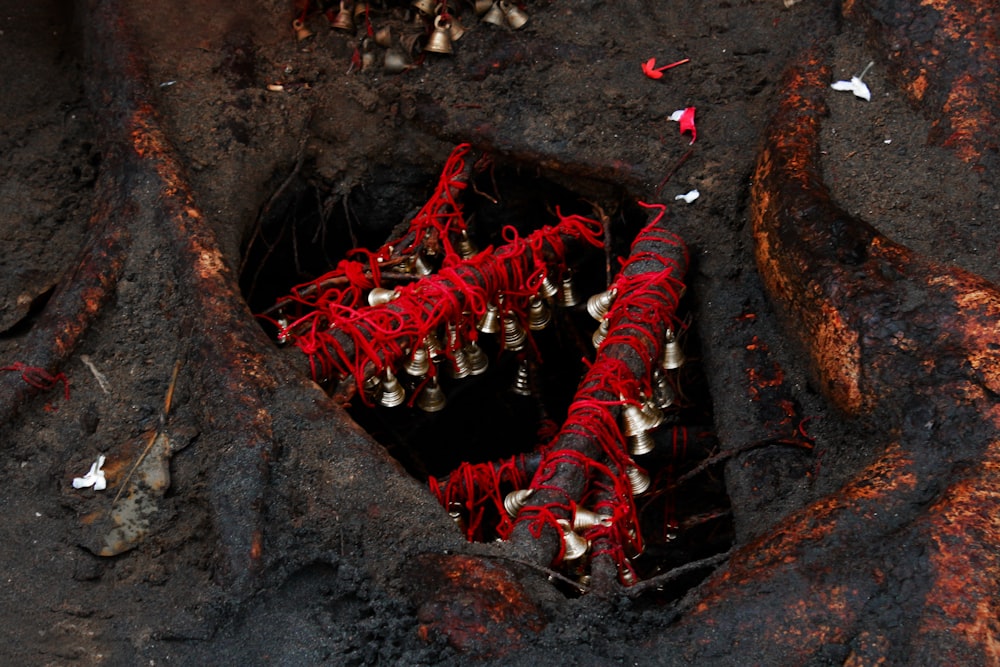 a group of bells in a hole in the ground