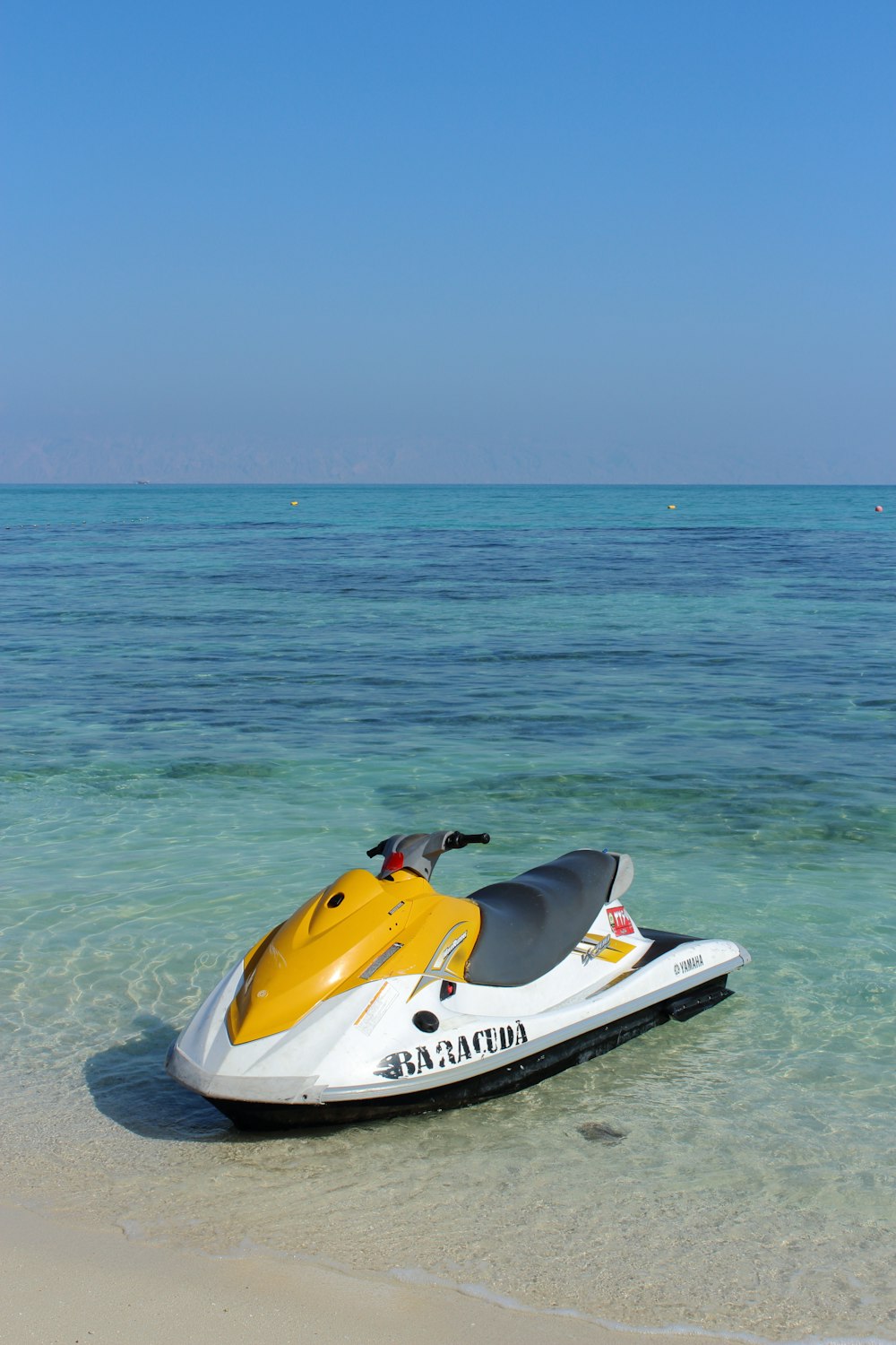 white and yellow personal watercraft