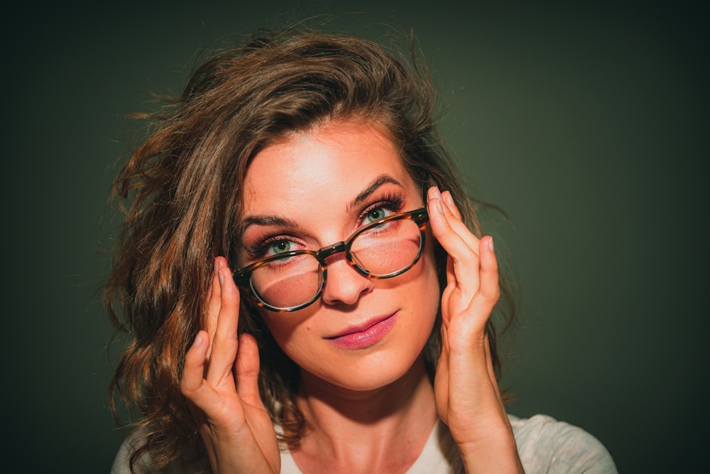 portrait of woman wearing eyeglasses with black frames