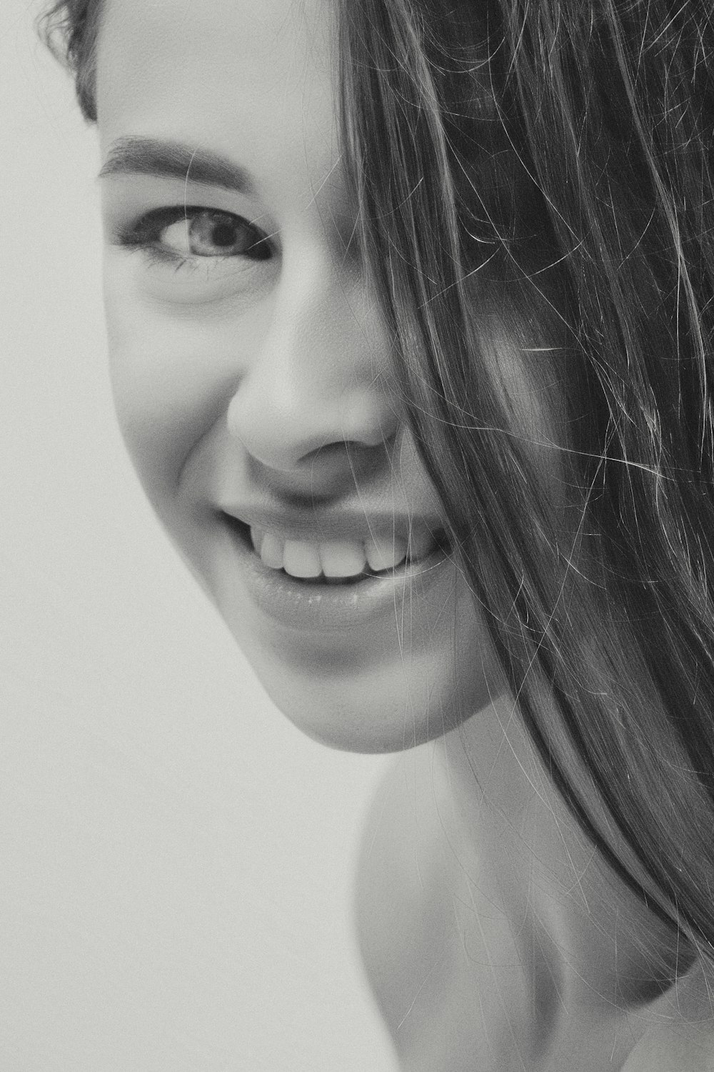 grayscale photography of smiling woman
