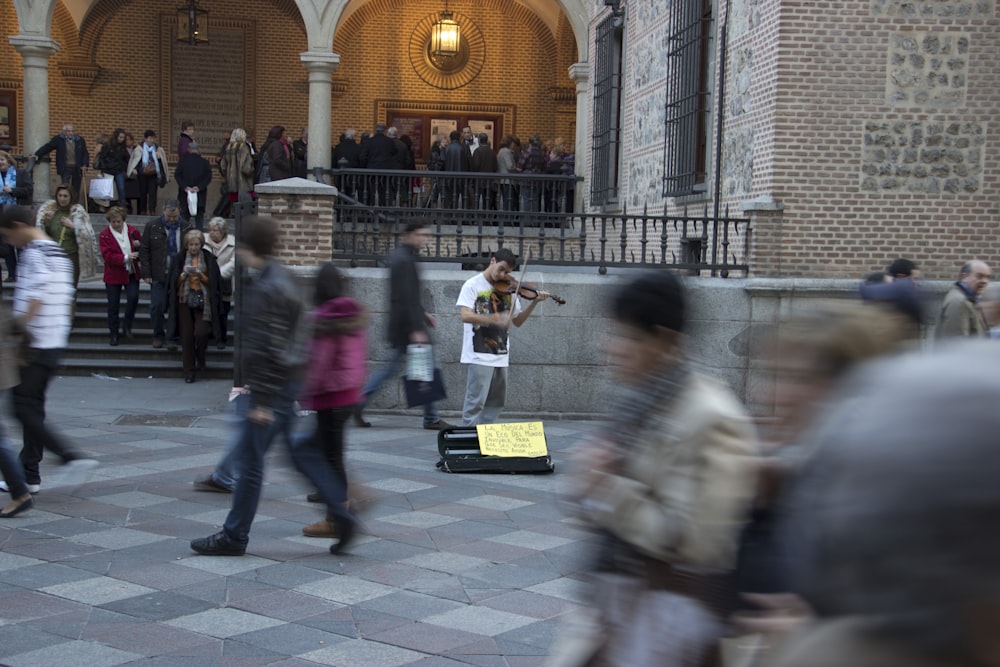 people walking in front of building