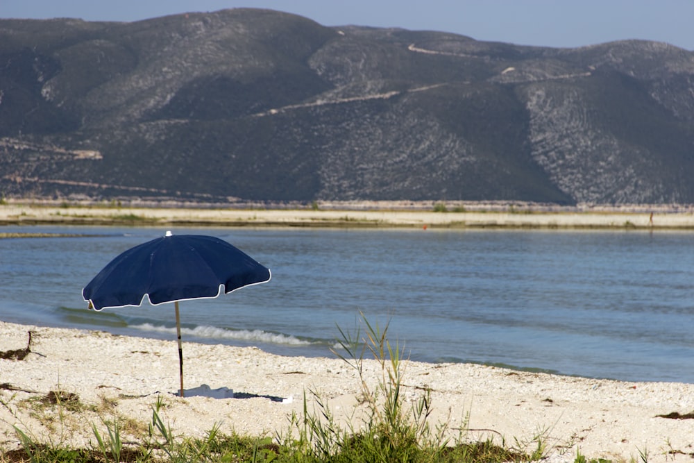 blue patio umbrella seashore