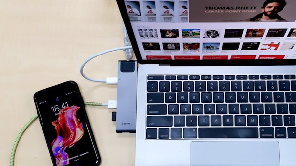 silver laptop computer turned-on