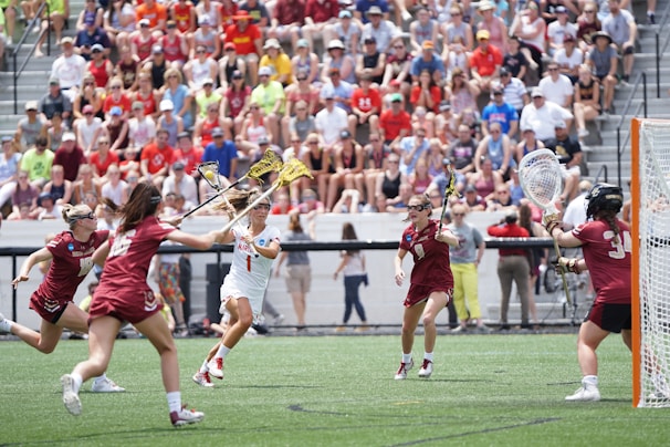 A dynamic action shot of a women's lacrosse game at American River College.