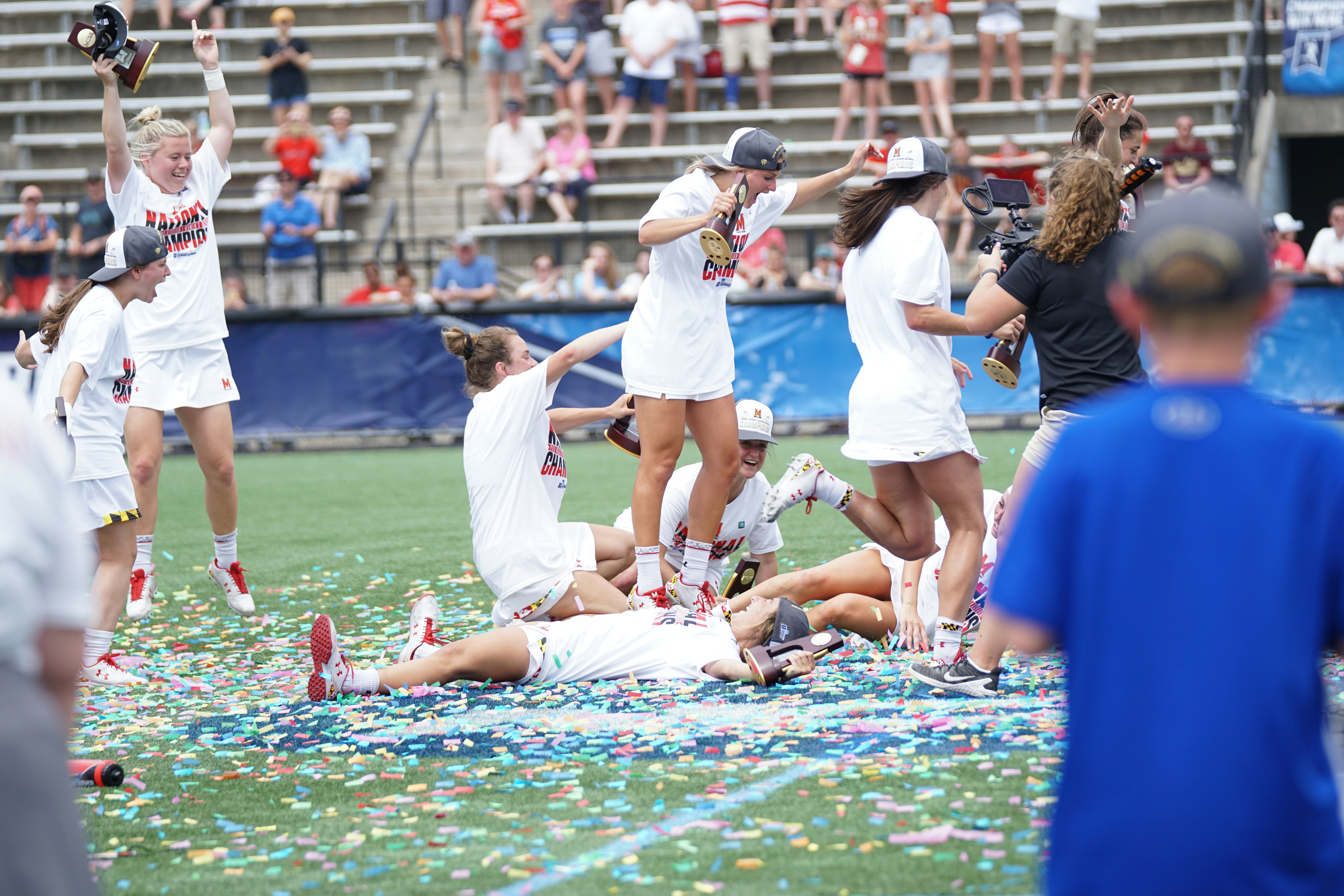 Pickleball doubles team celebrating strategic middle court win with enthusiastic high-five