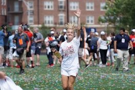 A smiling player celebrating a big win with confetti in the background.