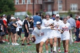 A group of athletes celebrating a victory on the podium.