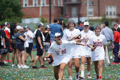 Athletes celebrating a competition win with medals and big smiles.