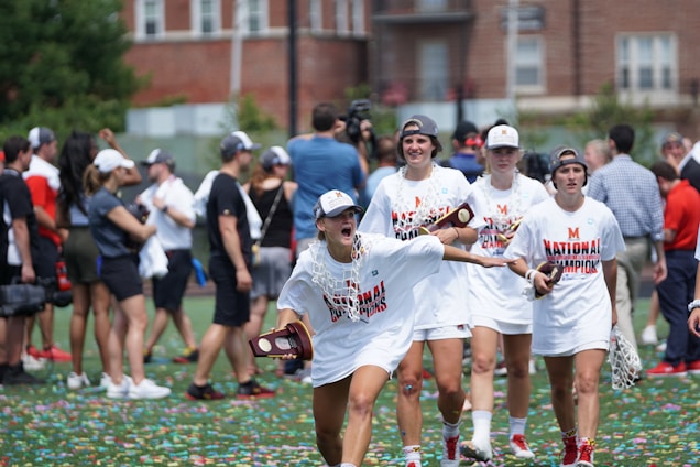 A diverse group of athletes celebrating at a sports event.