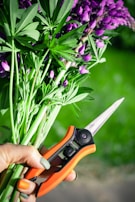 person holding orange and black cutter