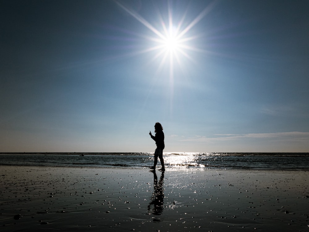 person standing on the seashore