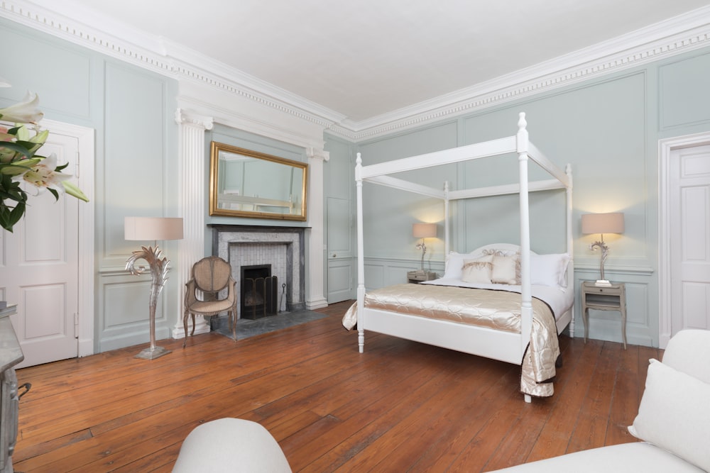 white canopy bed inside bedroom