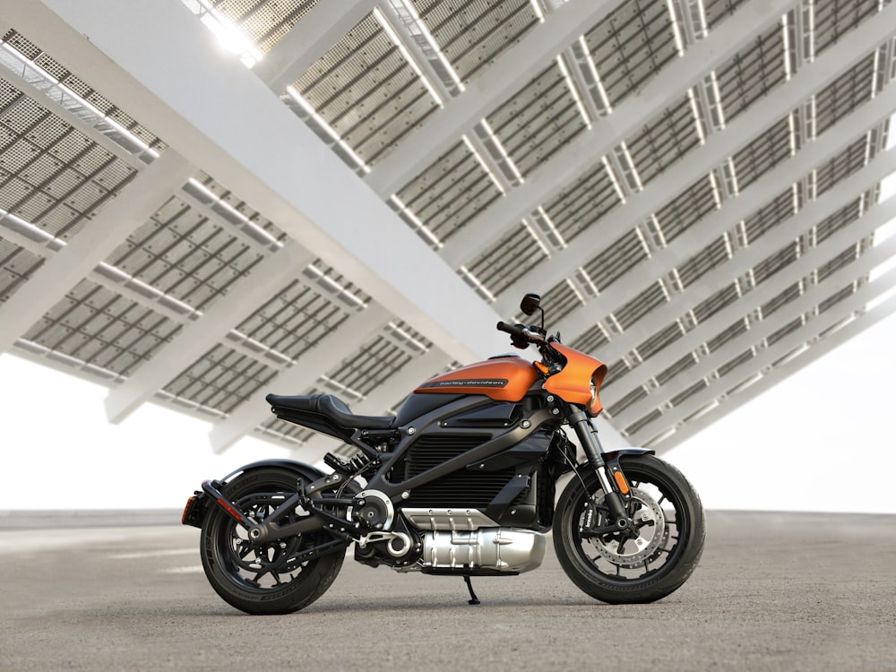 black and orange motorcycle