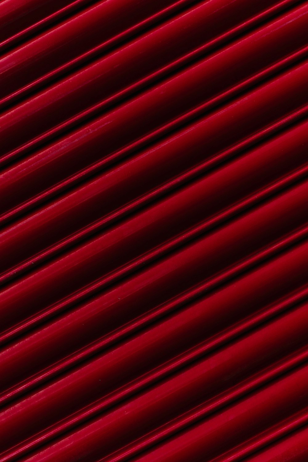 a close up of a red metal surface