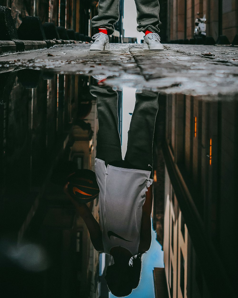 man standing on glassy water