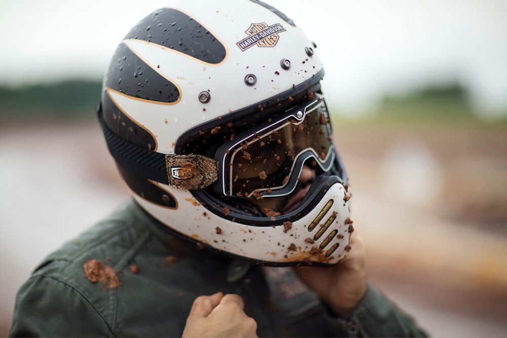 person wearing white and black helmet