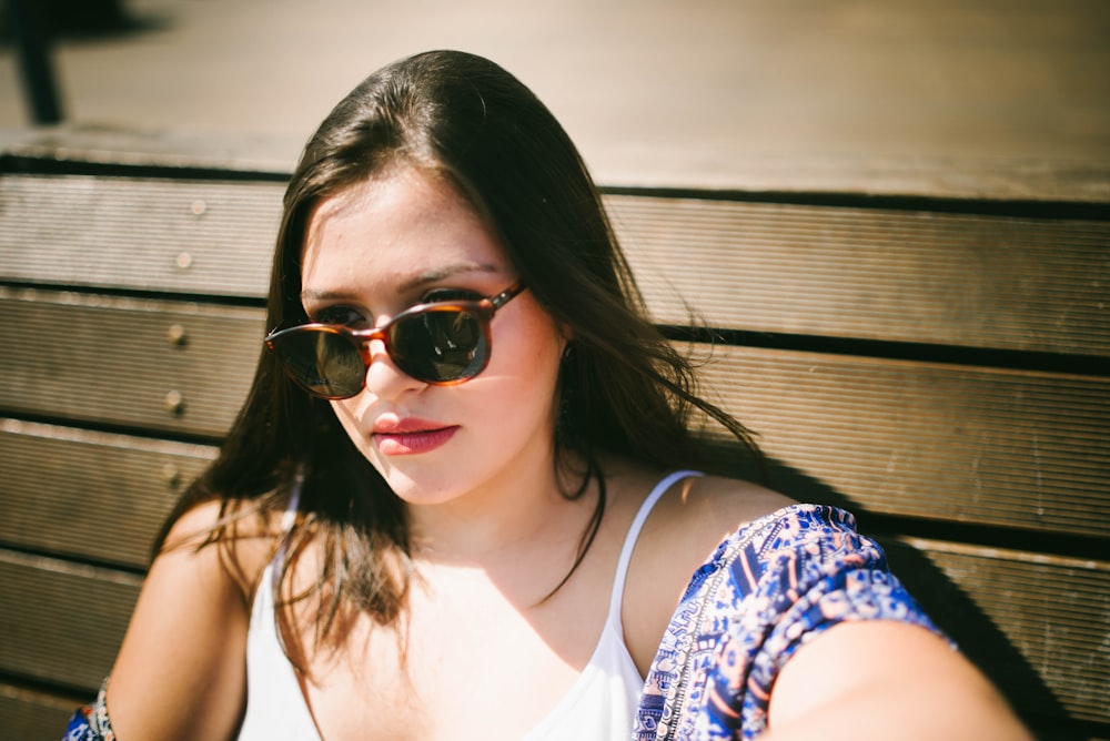 woman sitting near wall