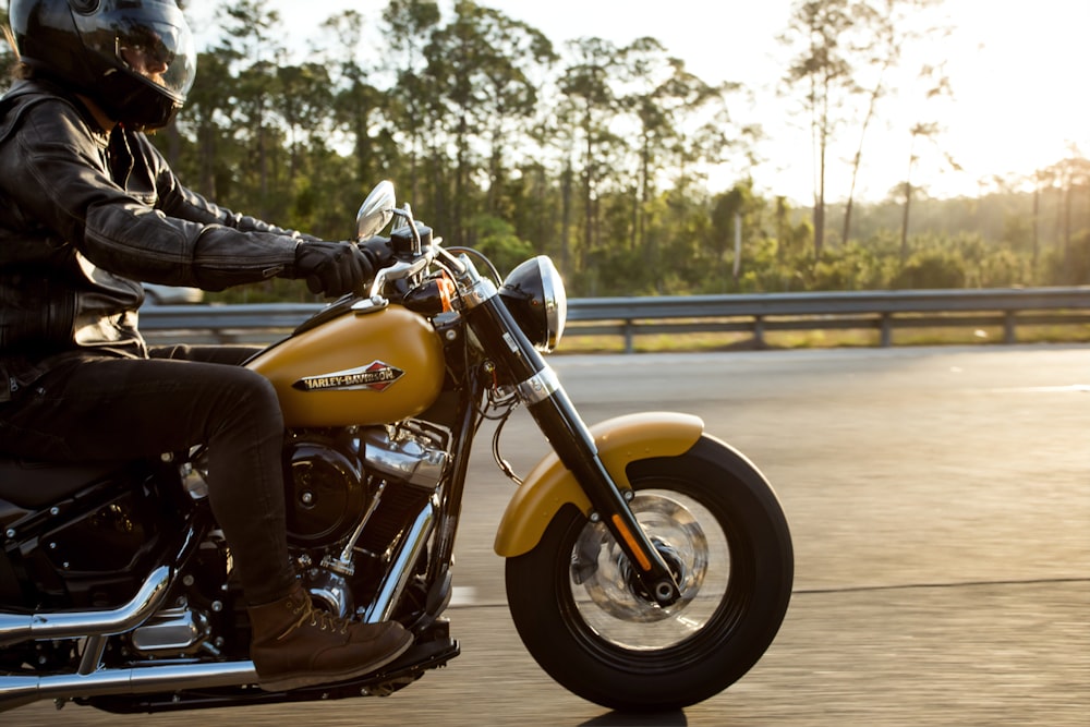 man riding motorcycle photography