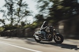 person riding cruiser motorcycle during daytime