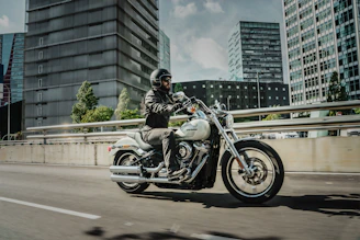 man riding cruiser motorcycle