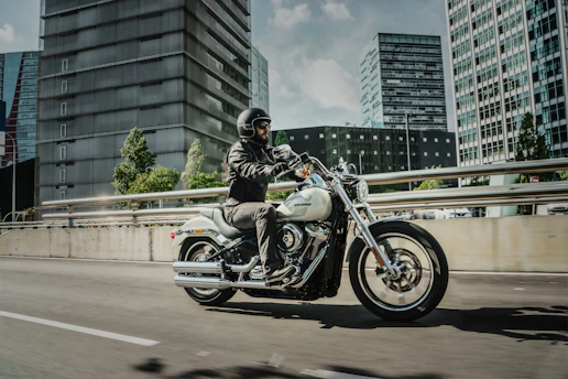 man riding cruiser motorcycle