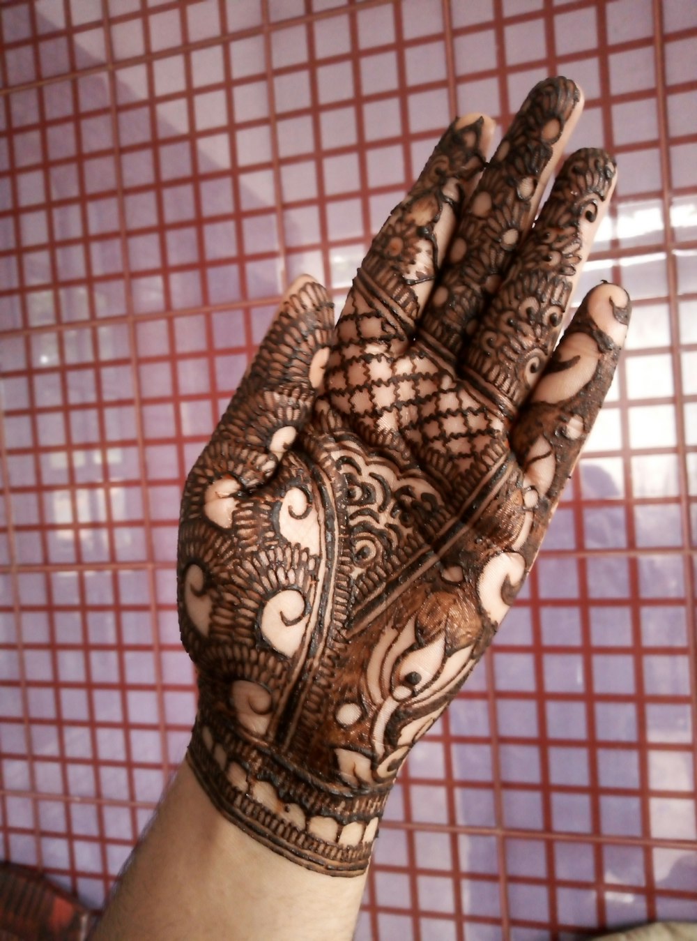 henna covered hand