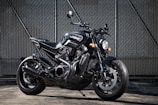 close-up photography of black motorcycle on motorcycle tyres sold at the tire store
