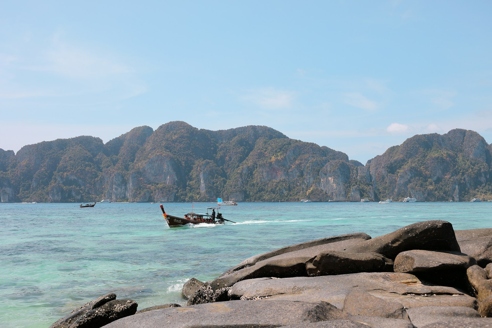 black boat near mountains