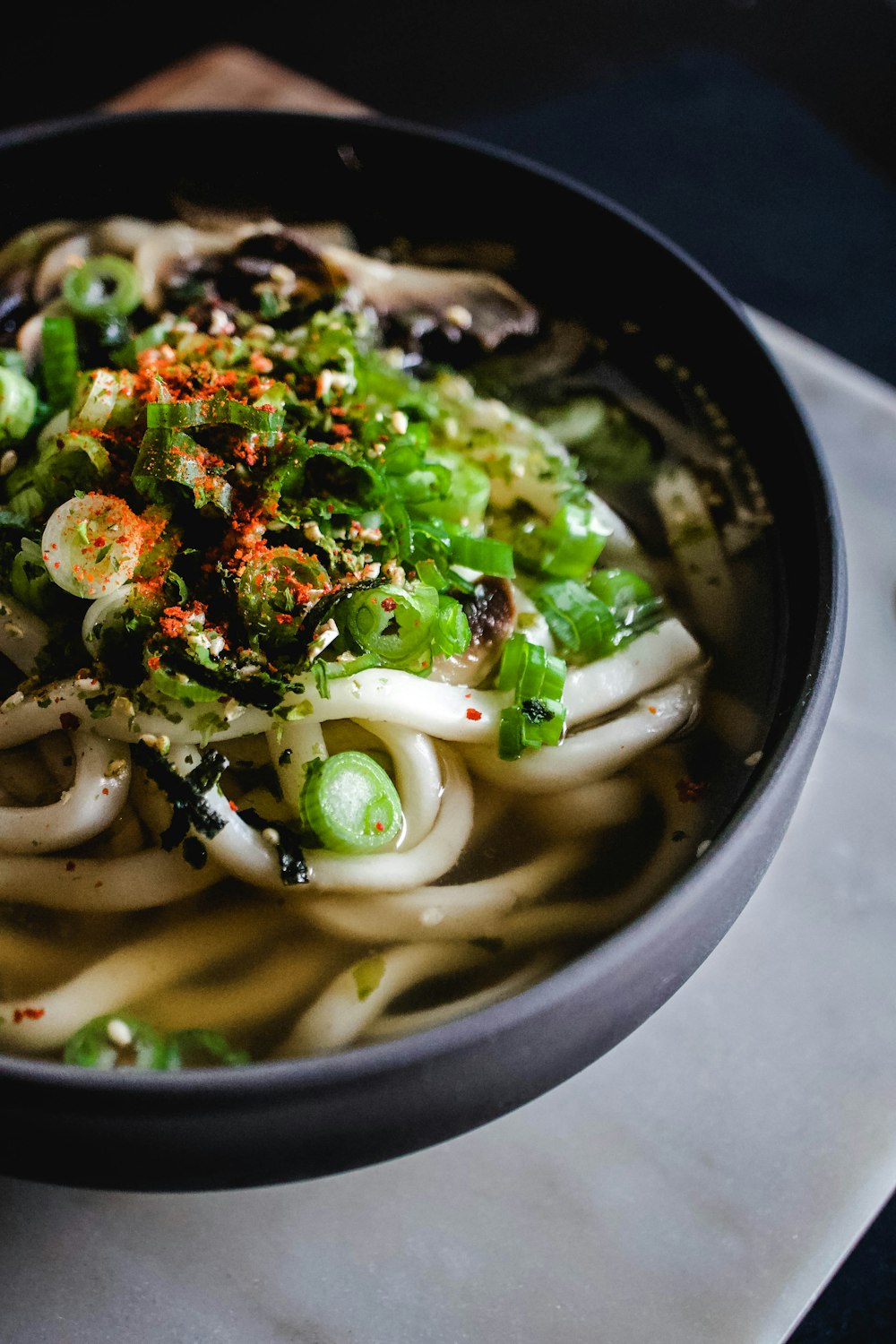 noodle soup on black bowl