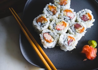 sushi food with brown wooden chopsticks