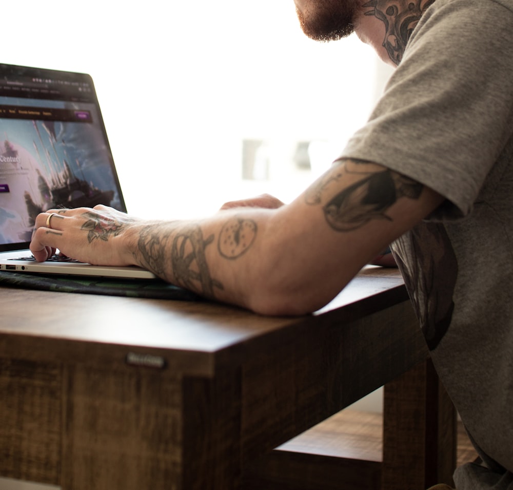 person facing on laptop computer