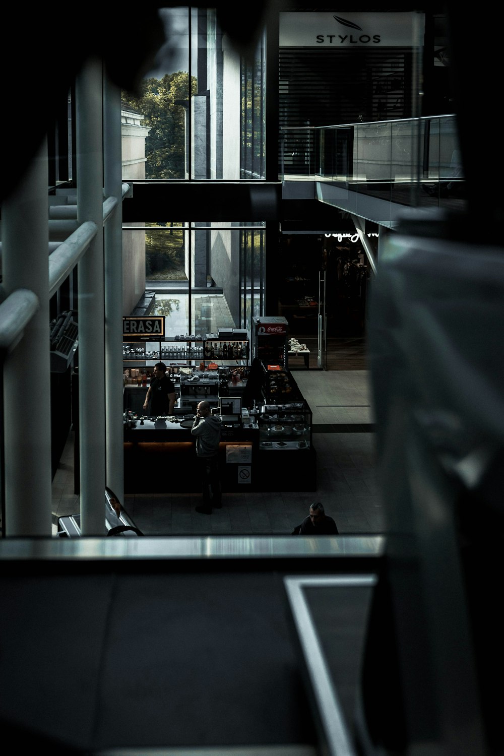 people in coffee bar in building ground floor