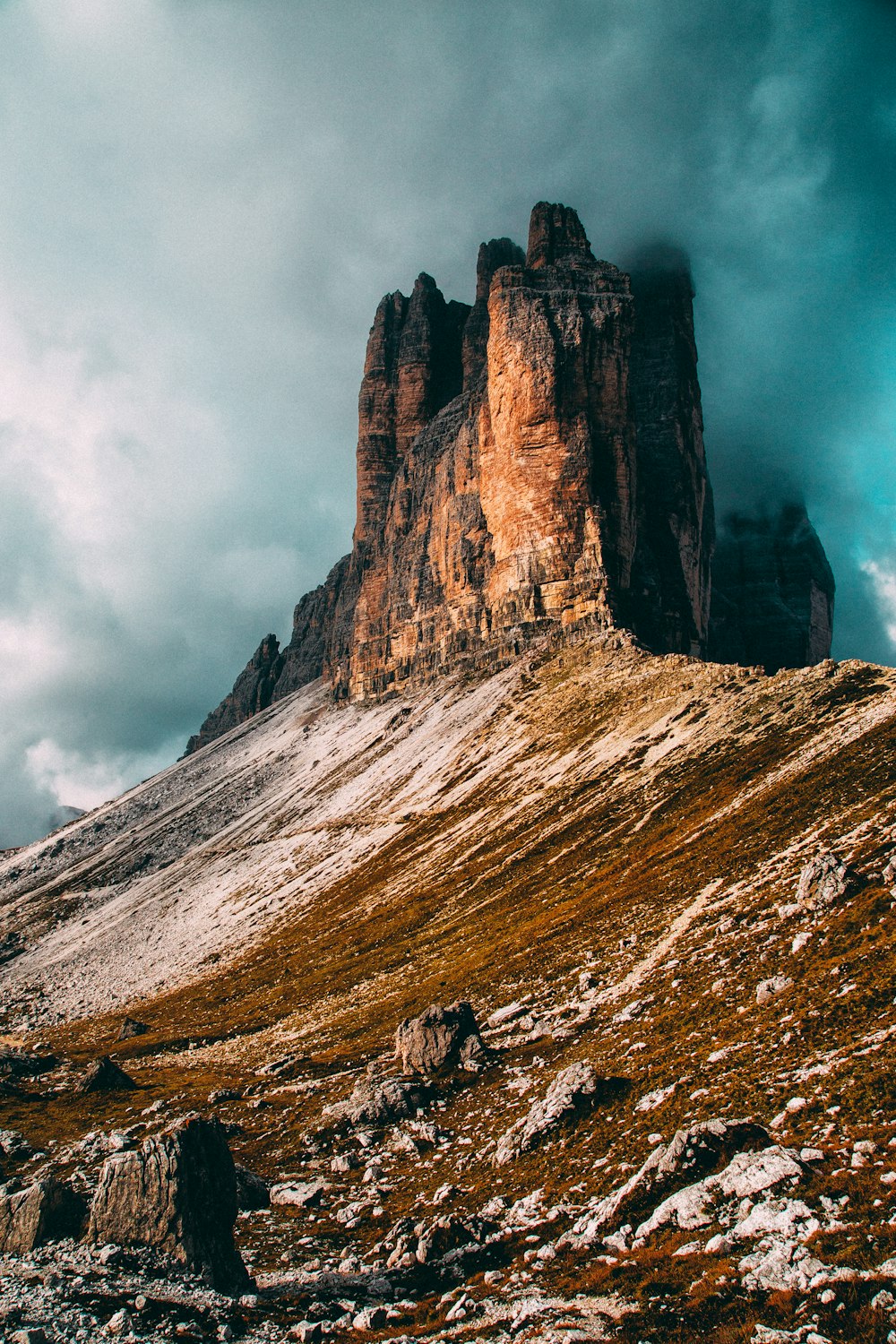 gray and brown rock formation under clouds