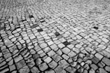Textured sandstone cobbles forming a rustic pathway.