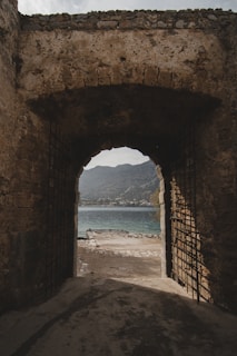 A serene natural archway bathed in gentle morning light, inviting peaceful reflection.