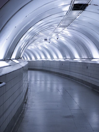 A sleek pneumatic tube system delivering groceries swiftly inside a modern gated society.