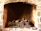 Close-up of a beautifully crafted brick fireplace inside a cozy living room.