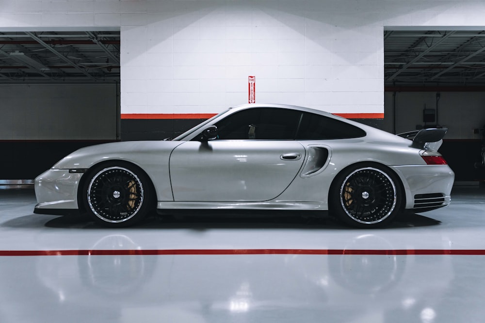 silver car parked inside building