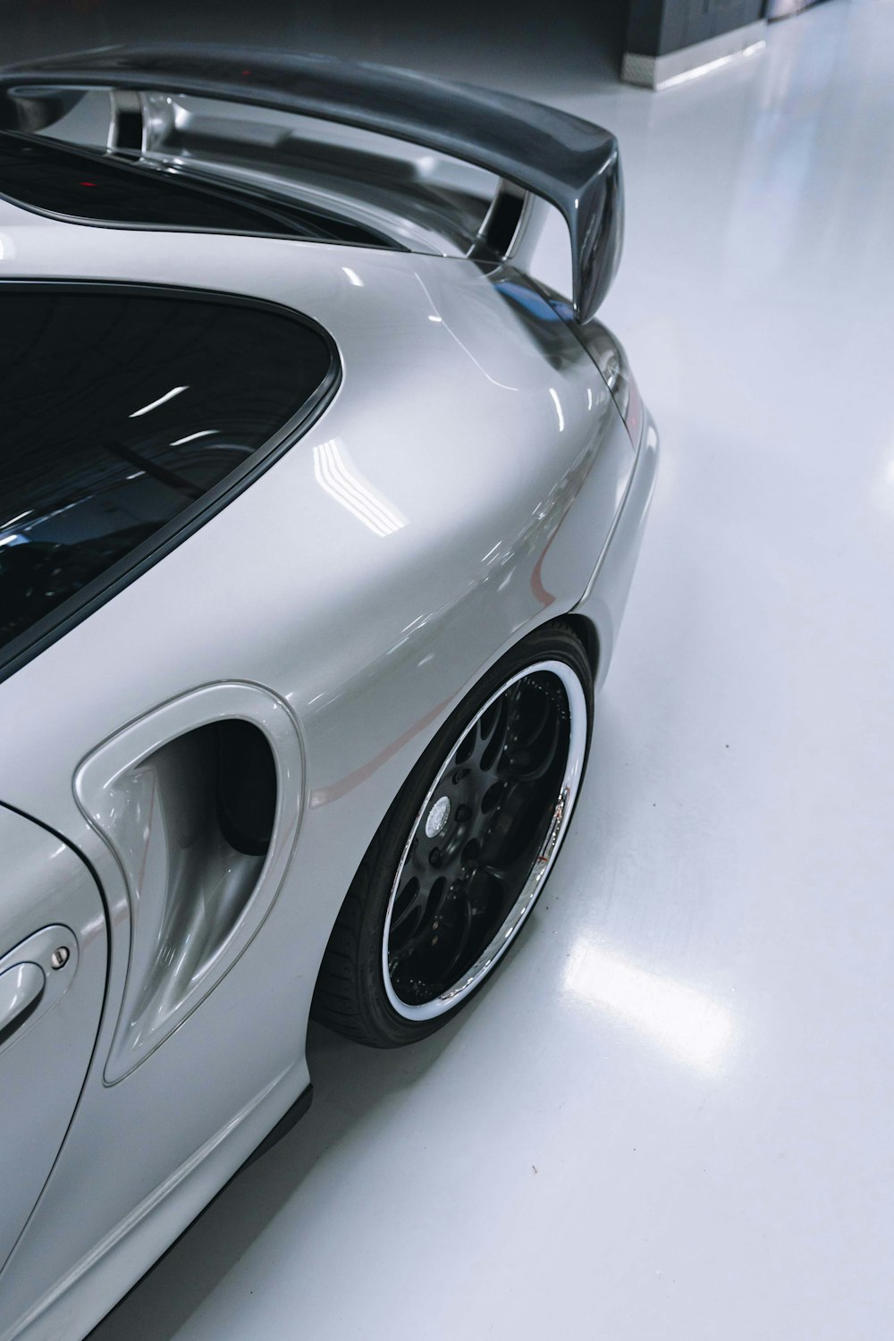 silver sports car with air intake scoop